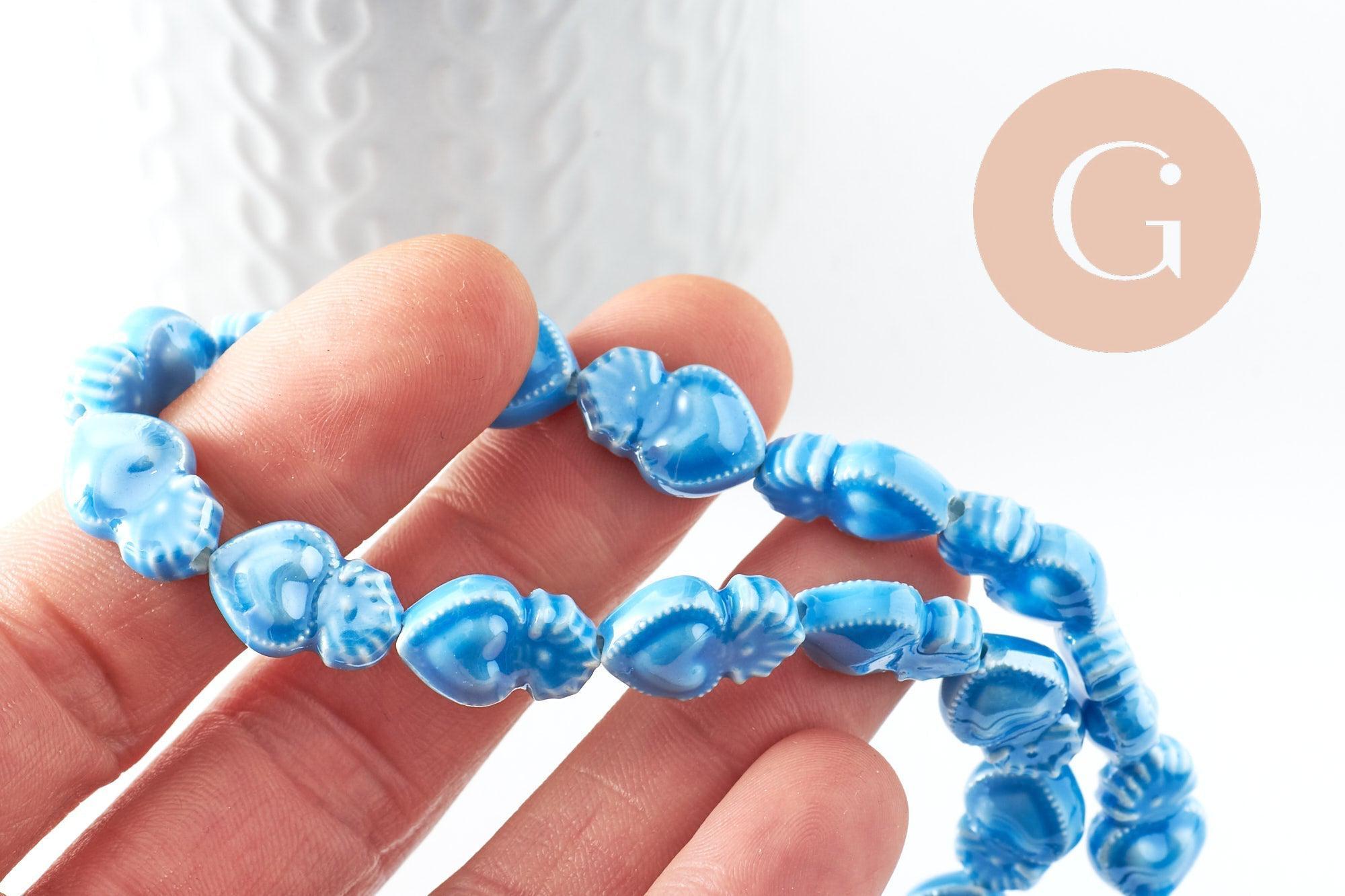 Gingerlily Perle porcelaine coeur bleu clair 16mm x24 irisé