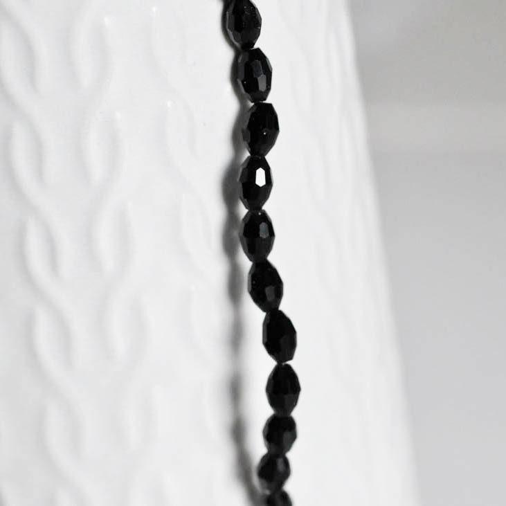 Gingerlily Perles verre noir grain de riz 6mm fil de 70