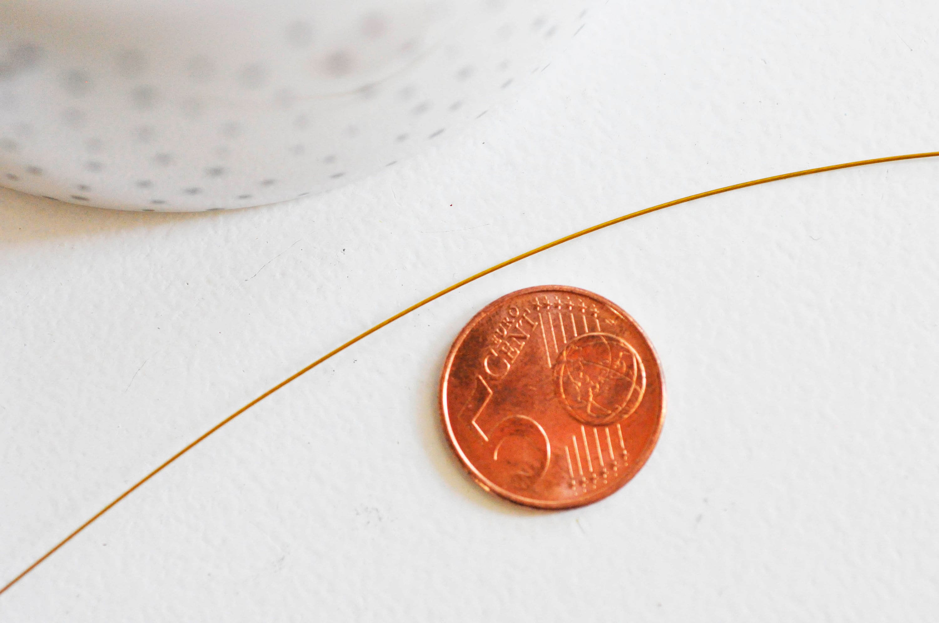 Gingerlily Fil acier gainé nylon doré 0,45mm 2m