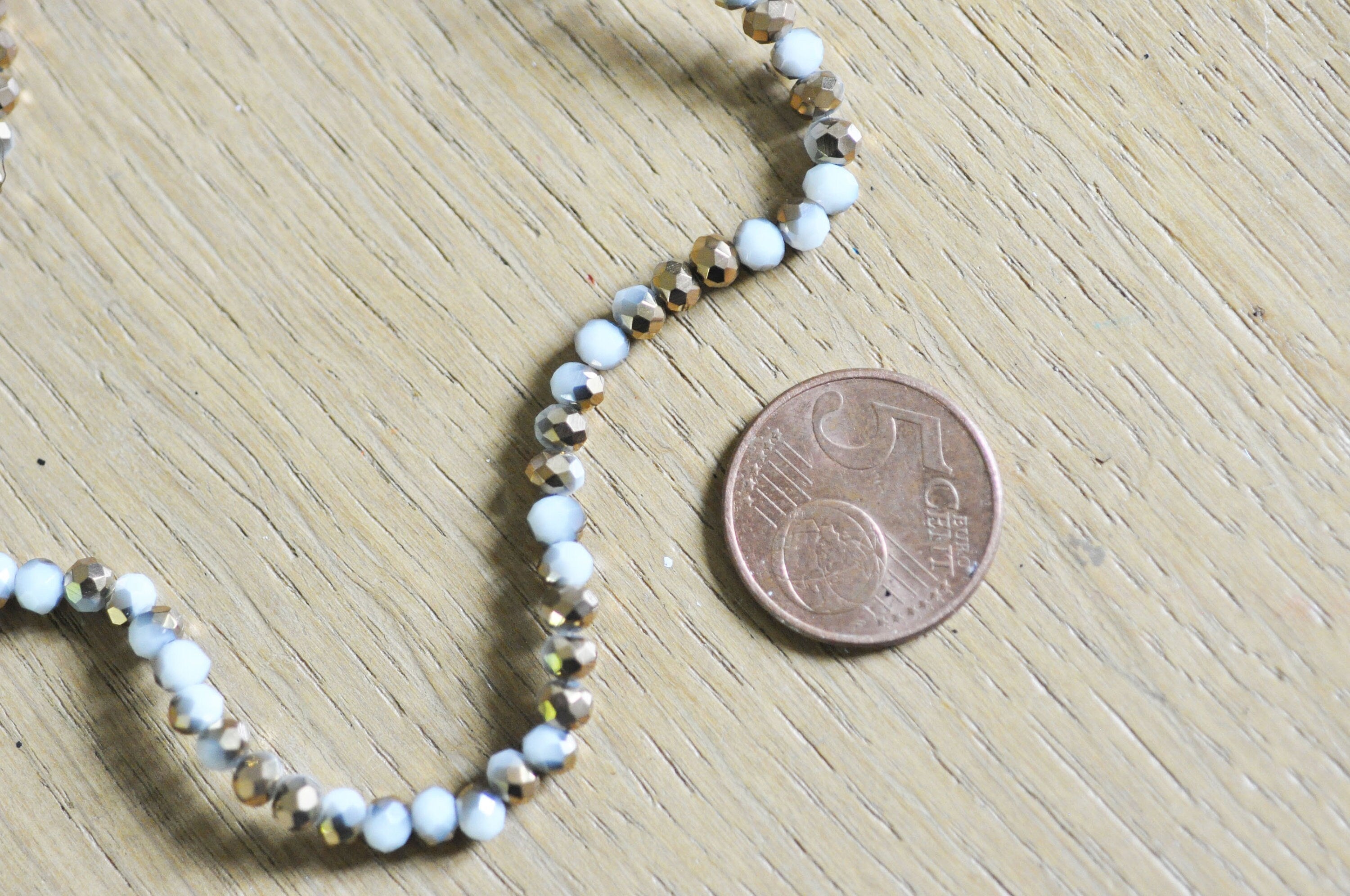 Gingerlily Perles toupies cristal blanc doré 4x3mm fil 120