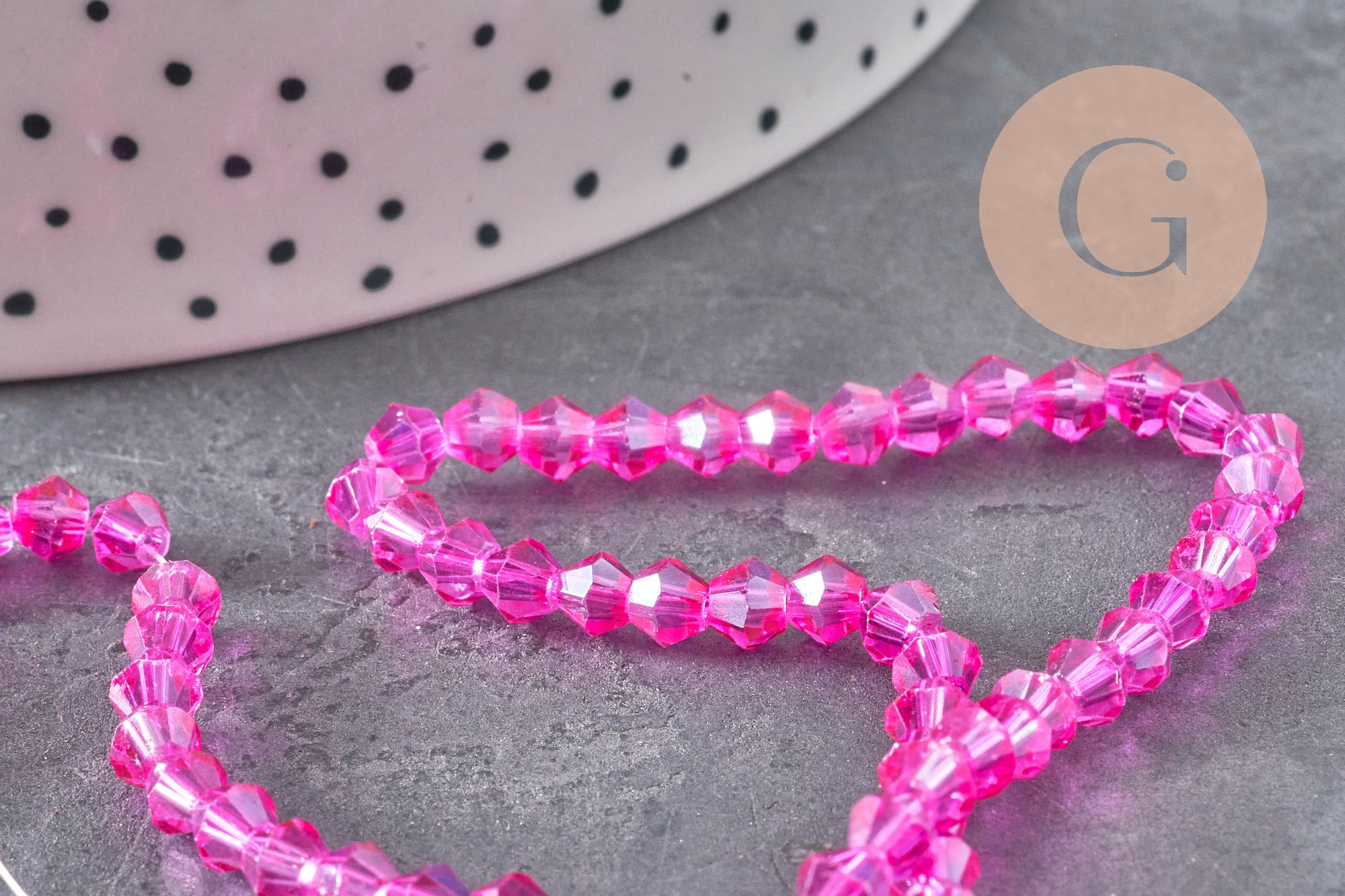 Gingerlily Perles toupies cristal rose fuchsia irisé 4.5mm fil 28cm