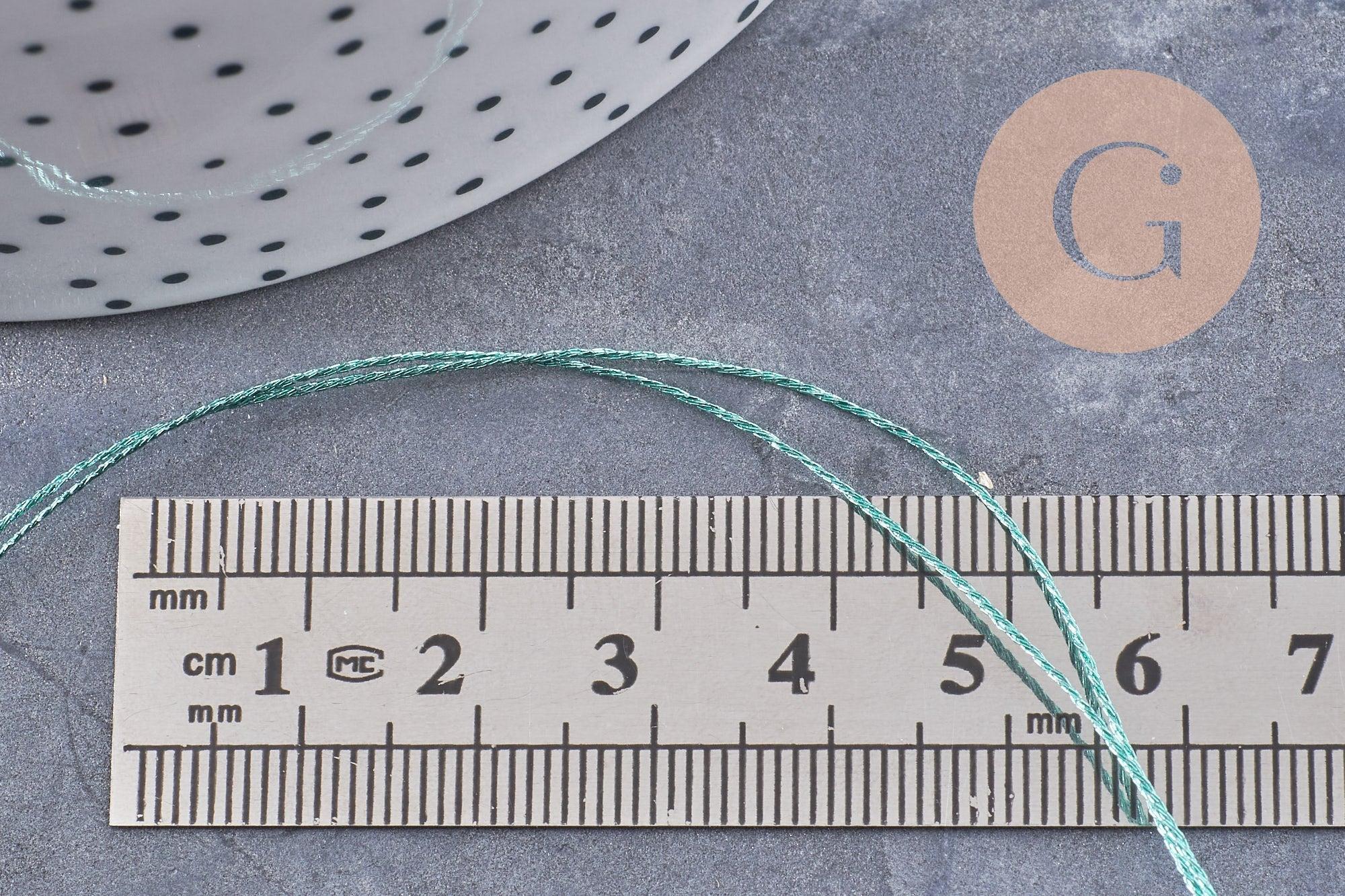 Gingerlily Cordons G10064 fil polyester vert or 0,4mm bobine 50m