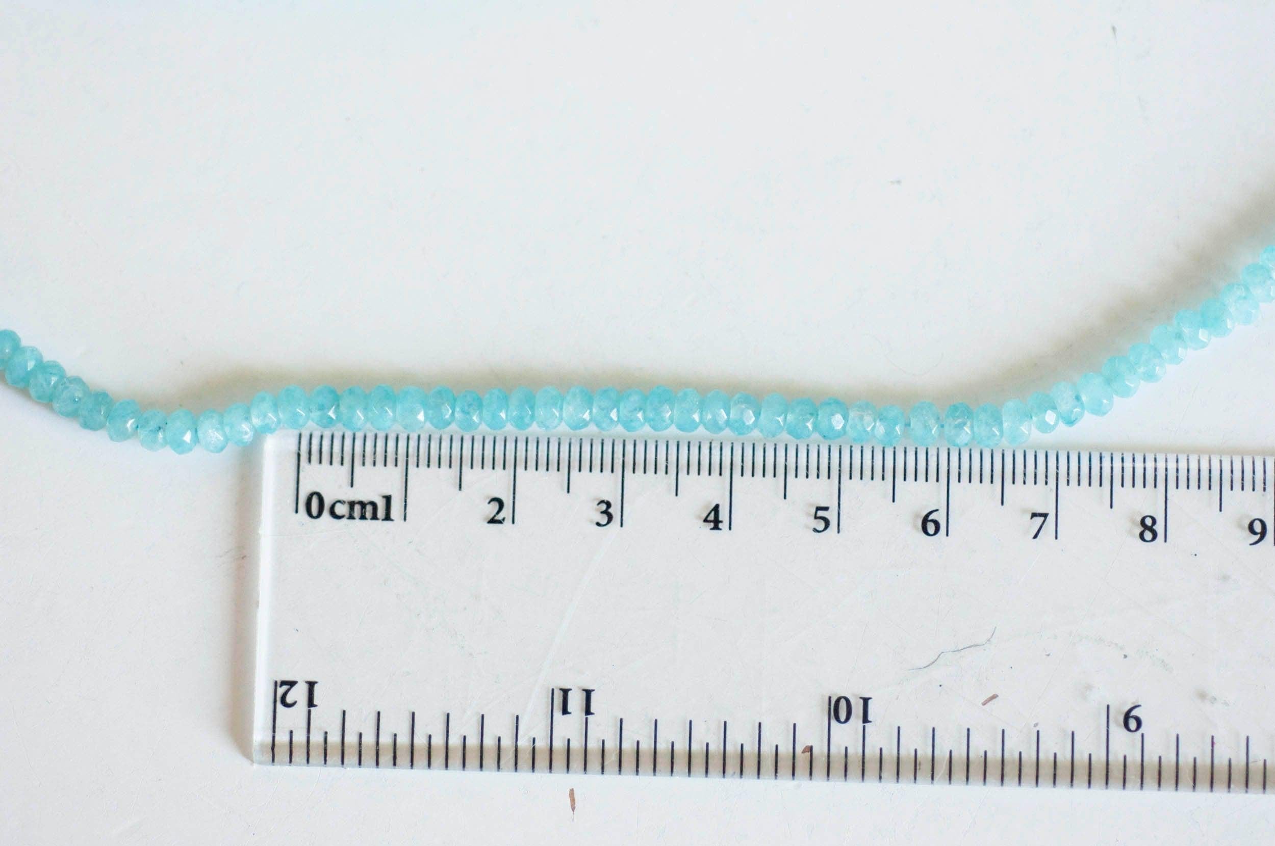 Gingerlily Perle abacus jade bleu 4x2mm fil 137 perles facettées