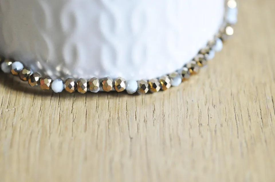 Gingerlily Perles toupies cristal blanc doré 4x3mm fil 120