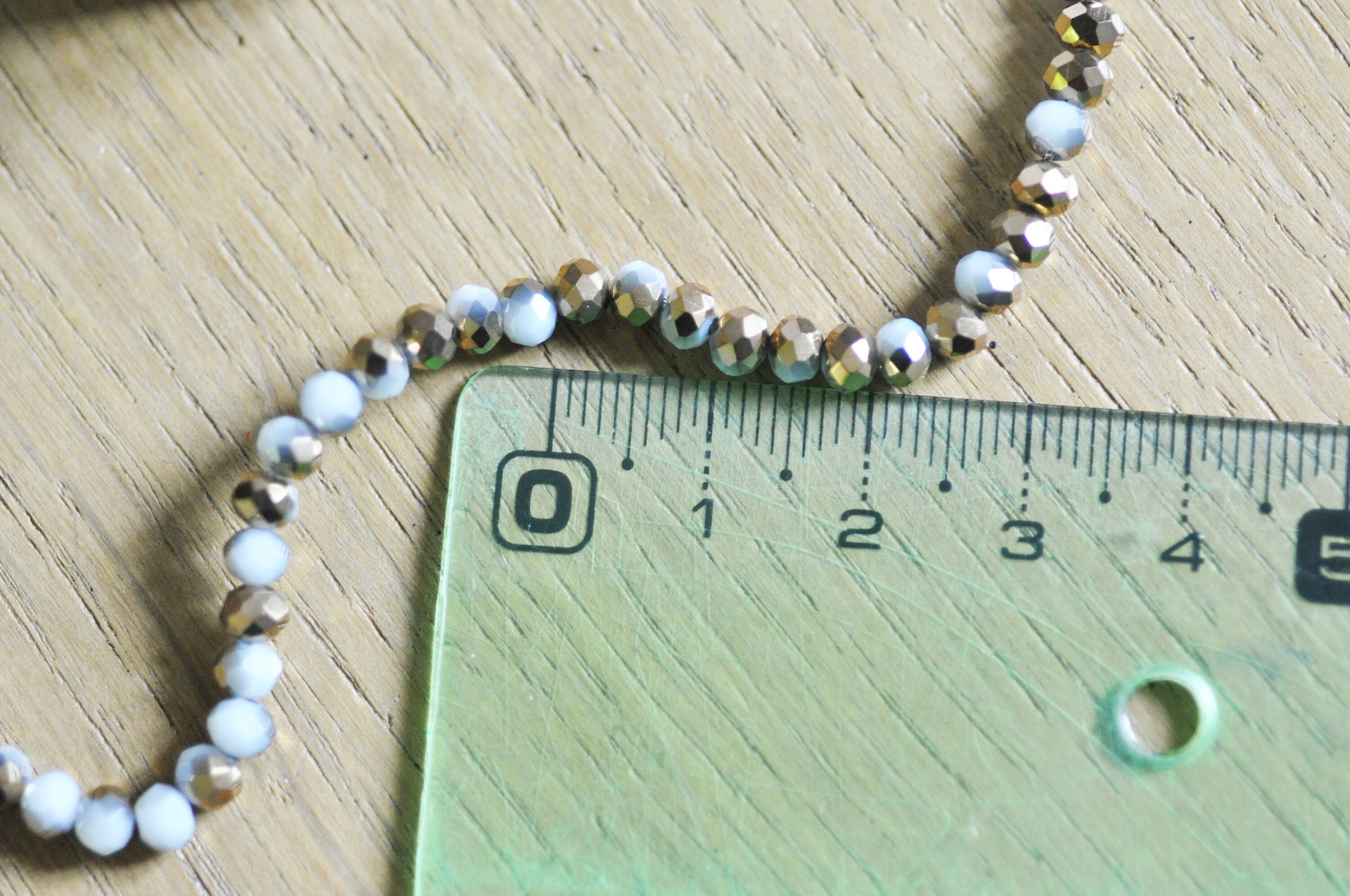 Gingerlily Perles toupies cristal blanc doré 4x3mm fil 120