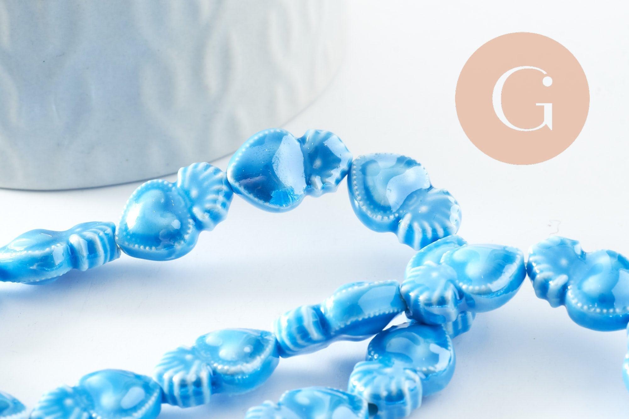 Gingerlily Perle porcelaine coeur bleu clair 16mm x24 irisé