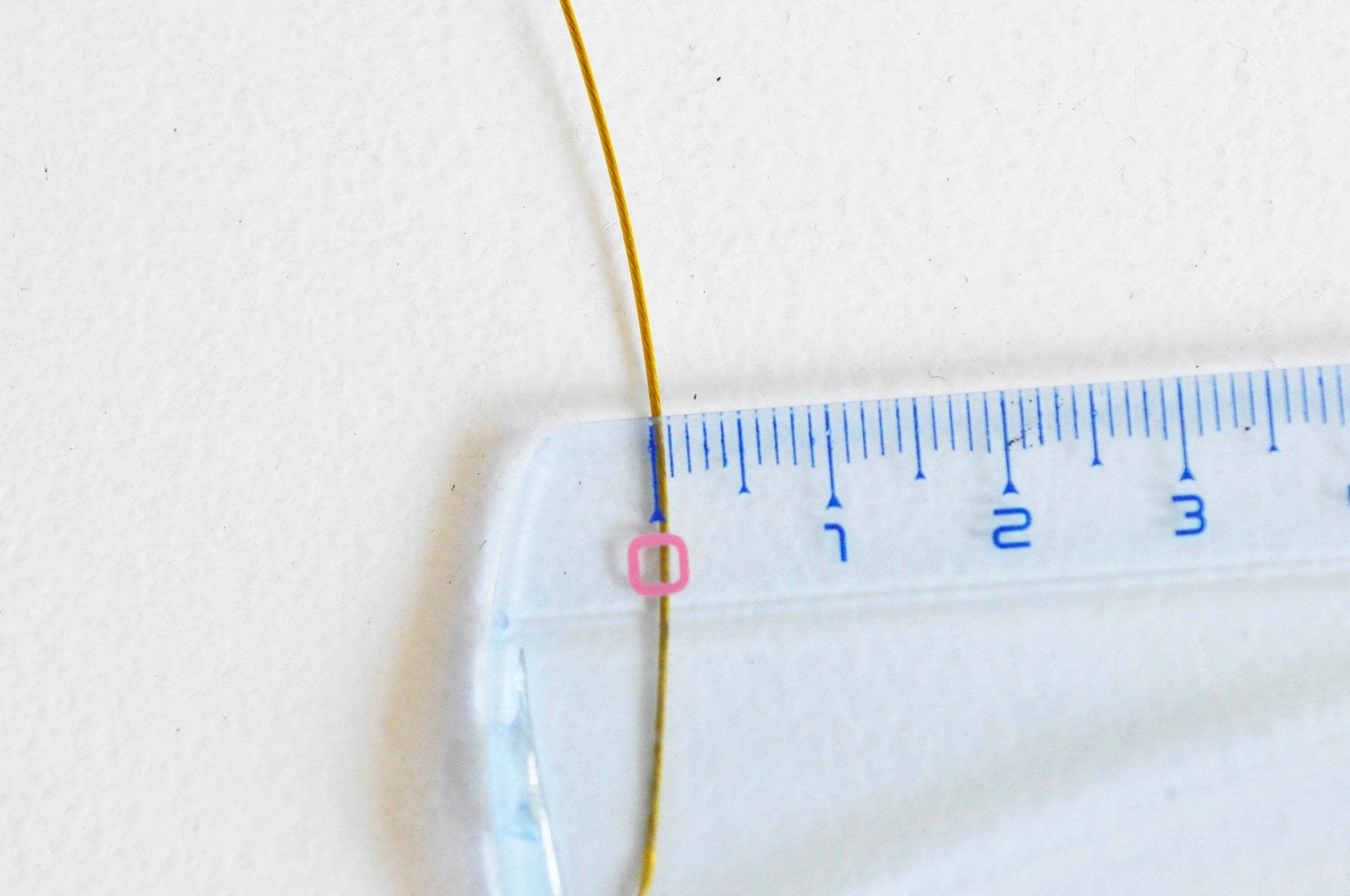 Gingerlily G3791 fil nylon acier doré 0,6mm bobine 2m