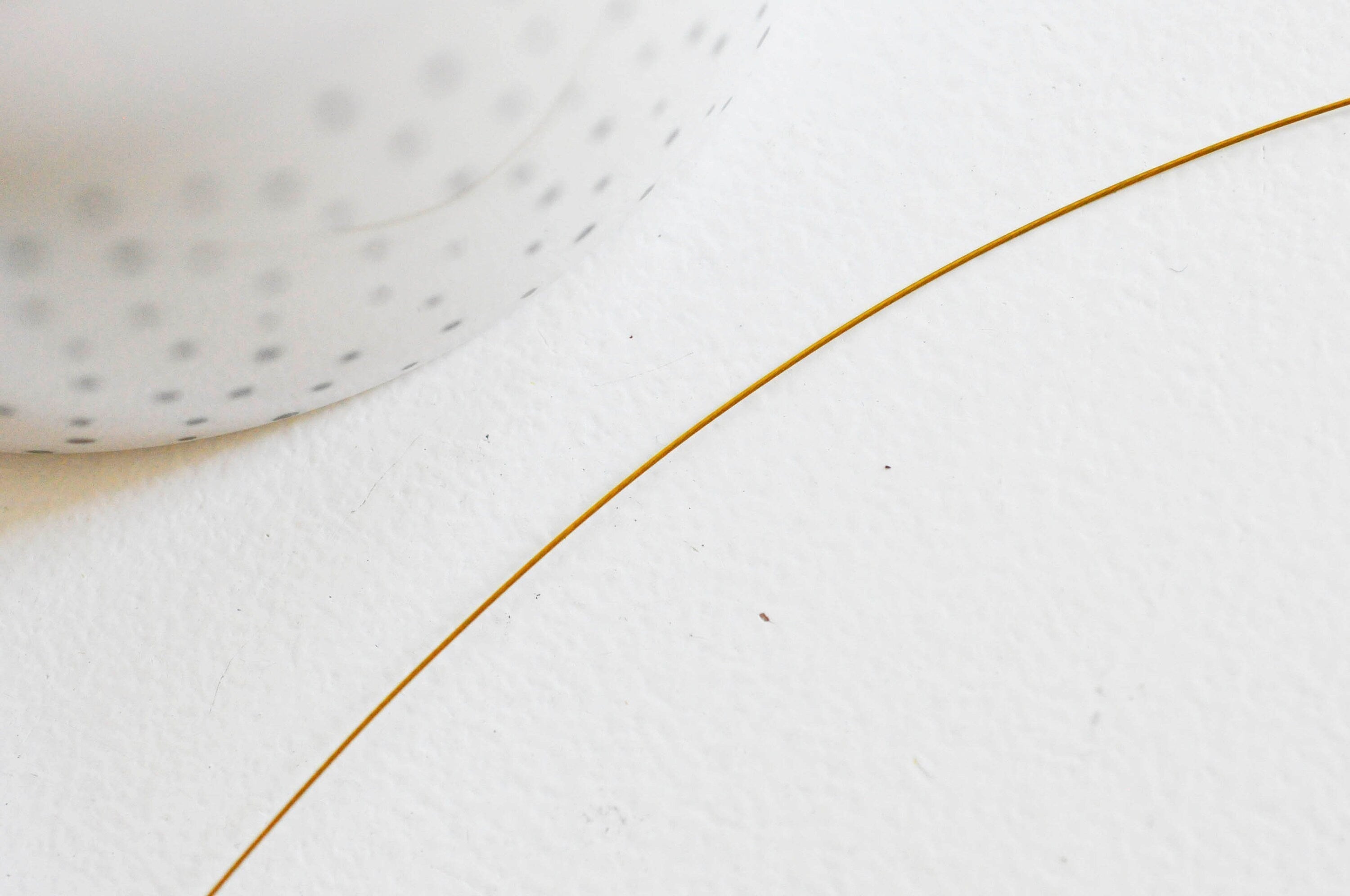 Gingerlily Fil acier gainé nylon doré 0,45mm 2m