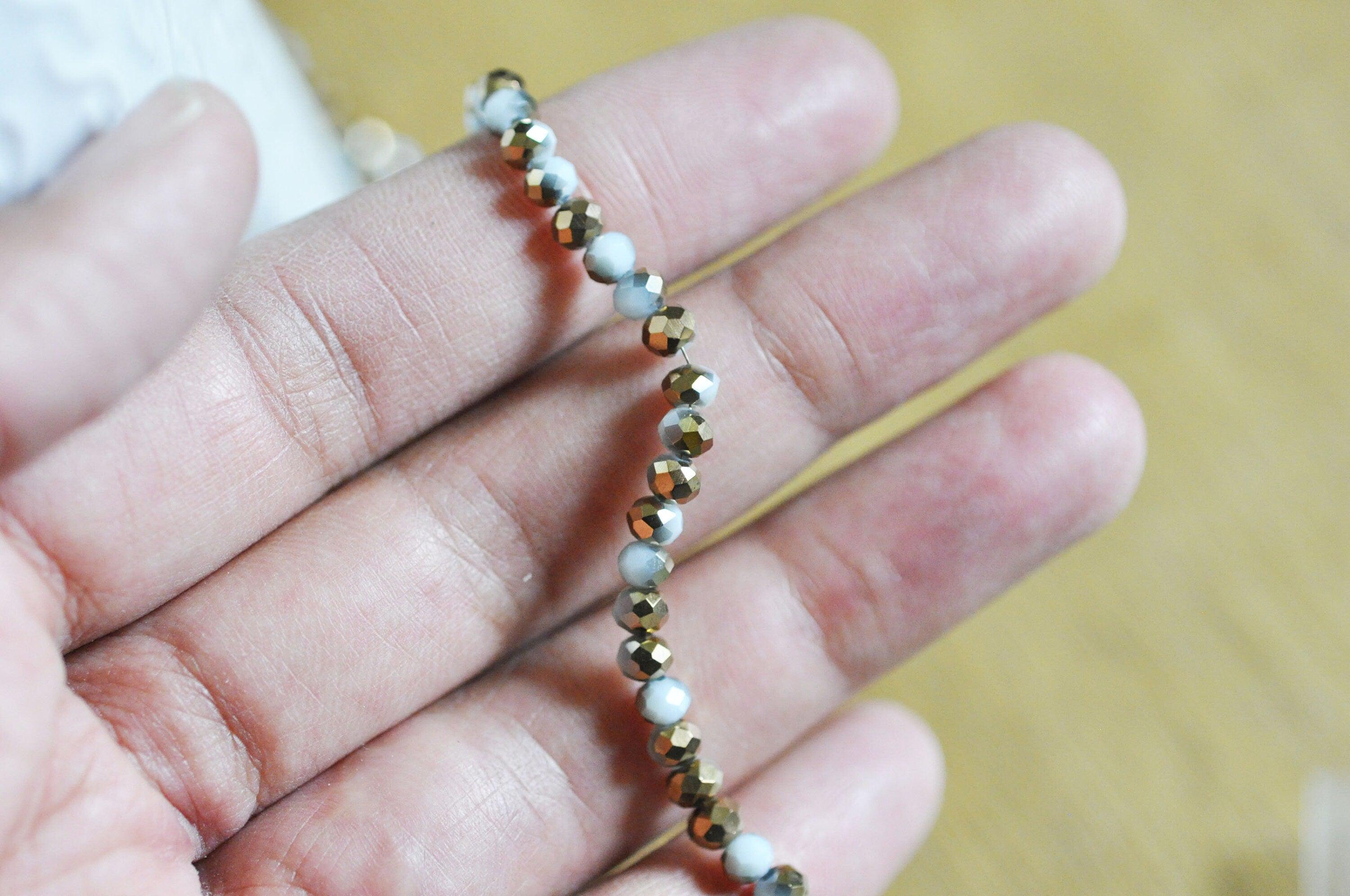 Gingerlily Perles toupies cristal blanc doré 4x3mm fil 120