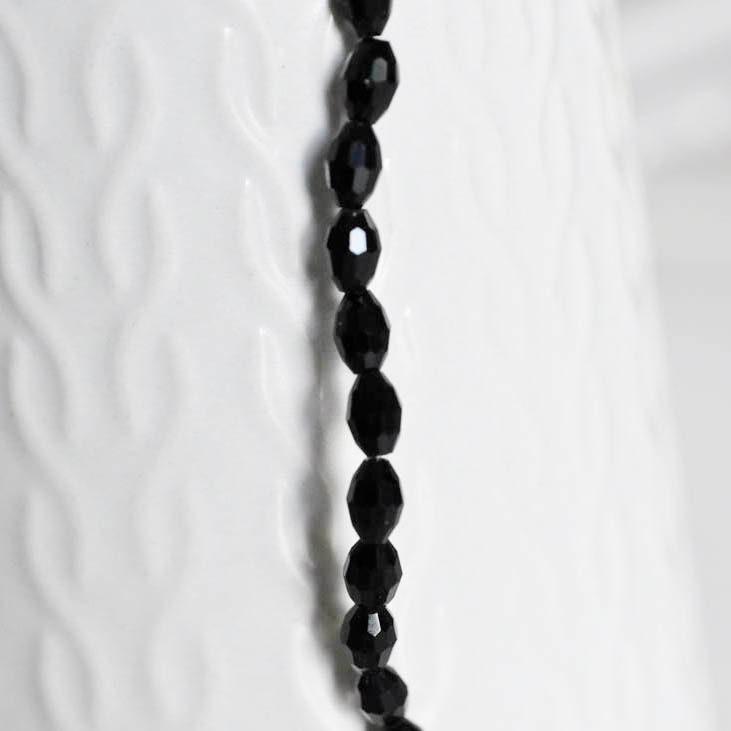 Gingerlily Perles verre noir grain de riz 6mm fil de 70