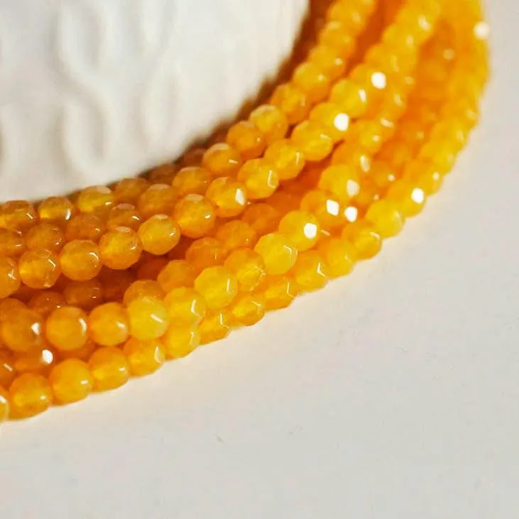 Gingerlily Perle jade jaune G7460 facettée 4mm fil