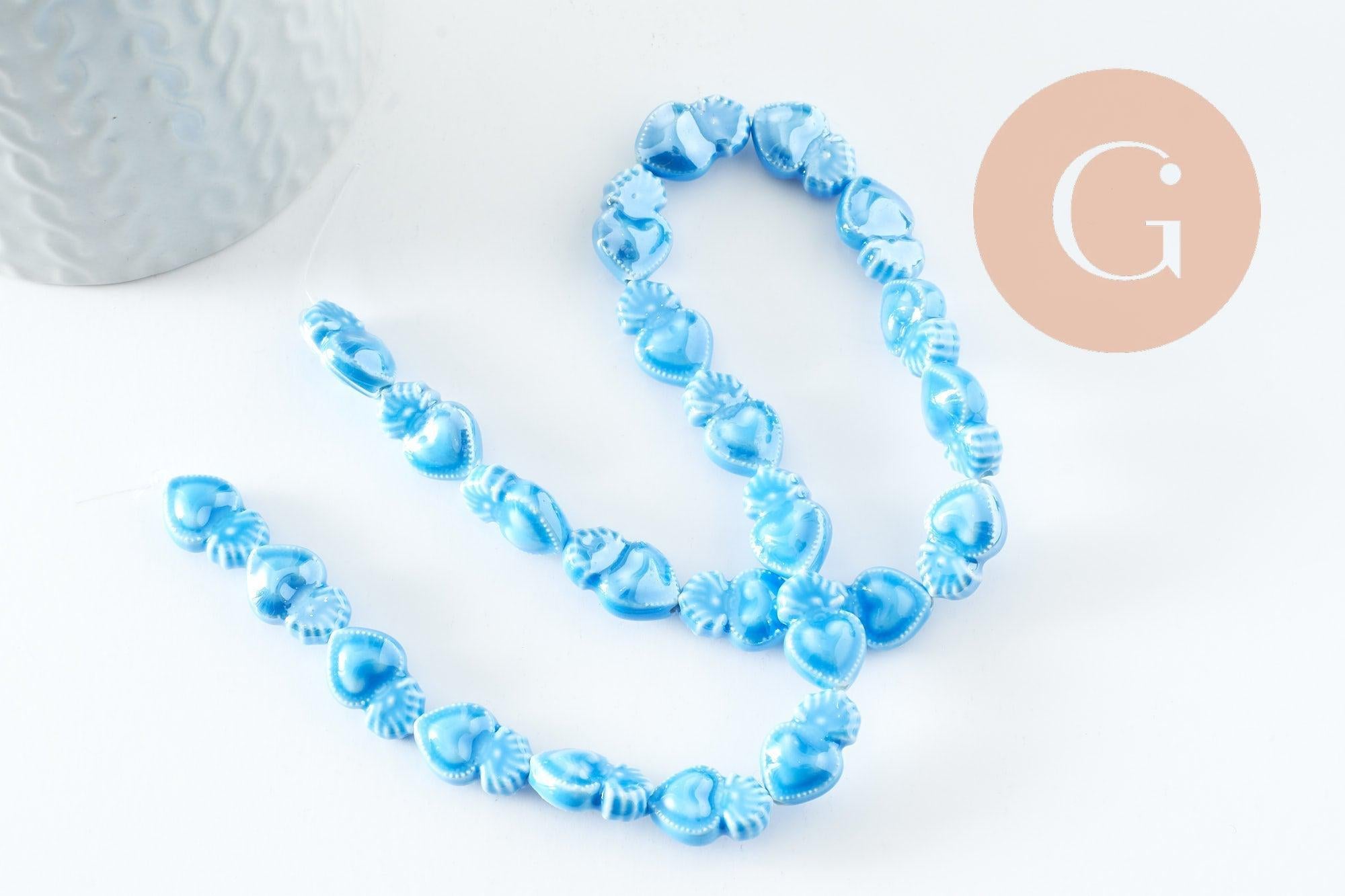 Gingerlily Perle porcelaine coeur bleu clair 16mm x24 irisé